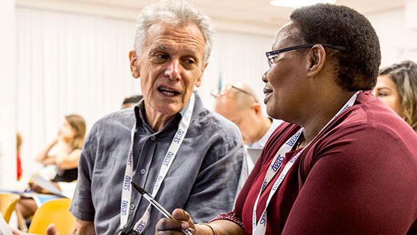 (Photo: British toxicologist Alaistar Hay talks with Elizabeth Njenga from Kenya at the 2019 AAAS-TWAS course in science diplomacy)